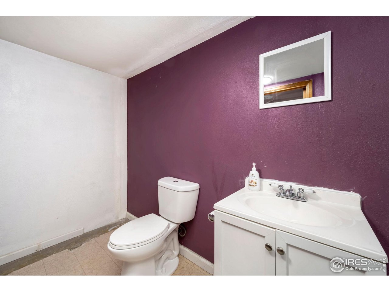 1113 East 24th Street Road Greeley, CO 80631 - Photo 17 of 25 a bathroom with a sink and a toilet