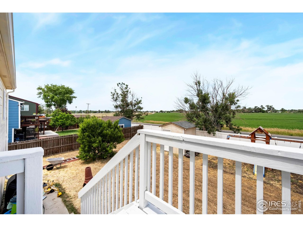 1113 East 24th Street Road Greeley, CO 80631 - Photo 19 of 25 a balcony view with a garden