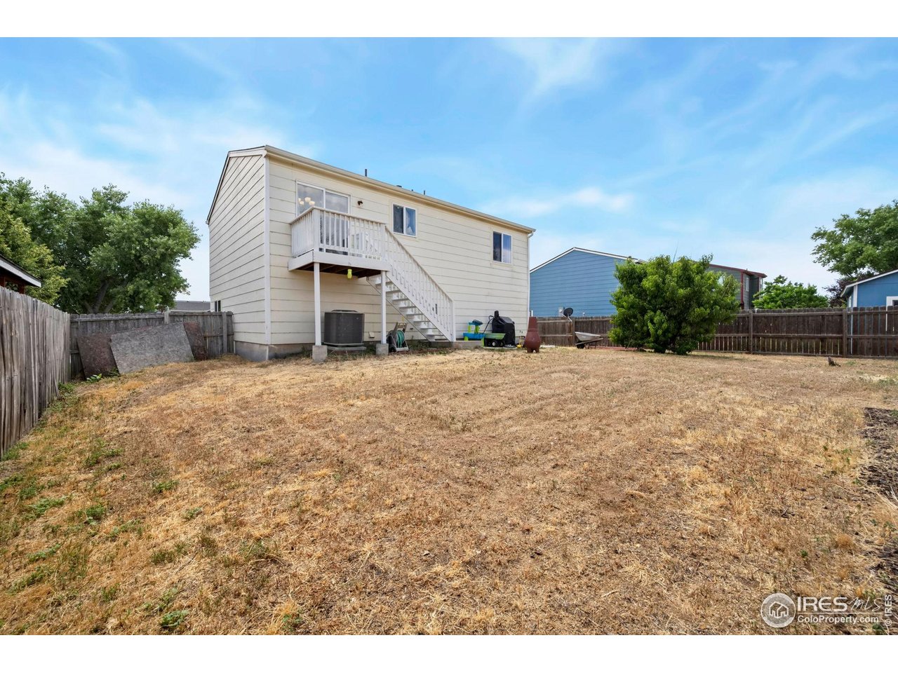 1113 East 24th Street Road Greeley, CO 80631 - Photo 21 of 25 a view of a house with a yard