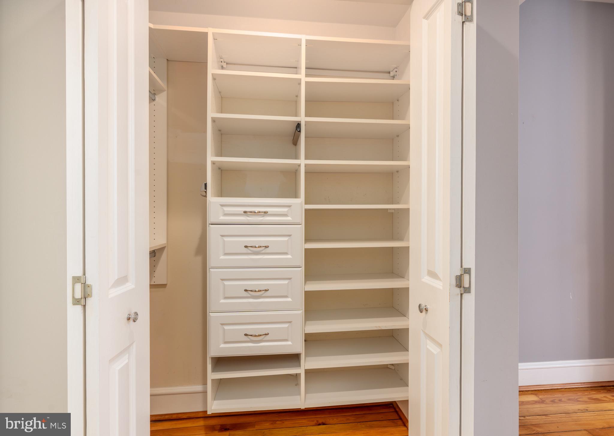 1716 22nd Street Northwest Washington, DC 20008 - Photo 19 of 40 a view of walk in closet with empty racks