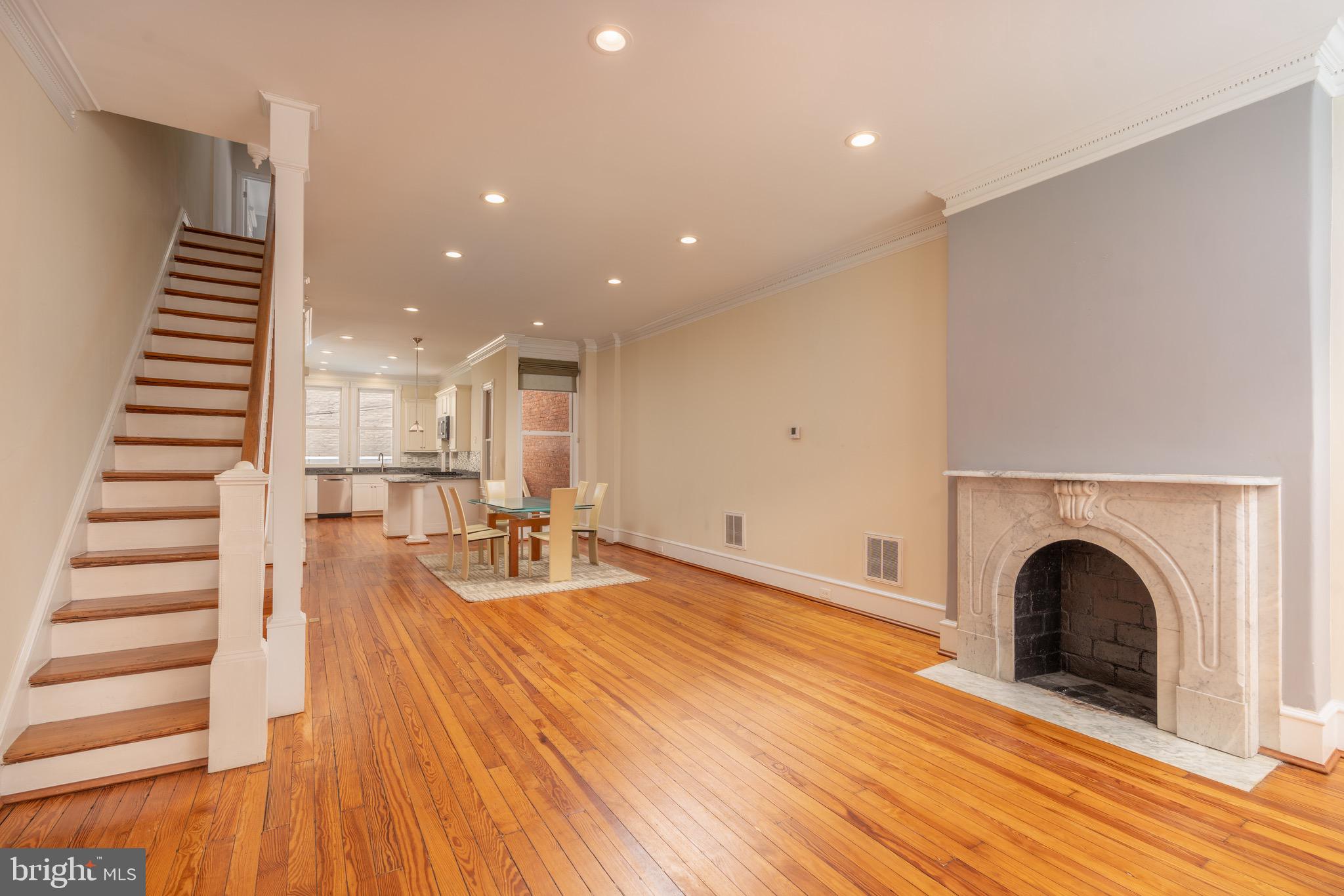 1716 22nd Street Northwest Washington, DC 20008 - Photo 2 of 40 a room with lots of furniture and a fireplace