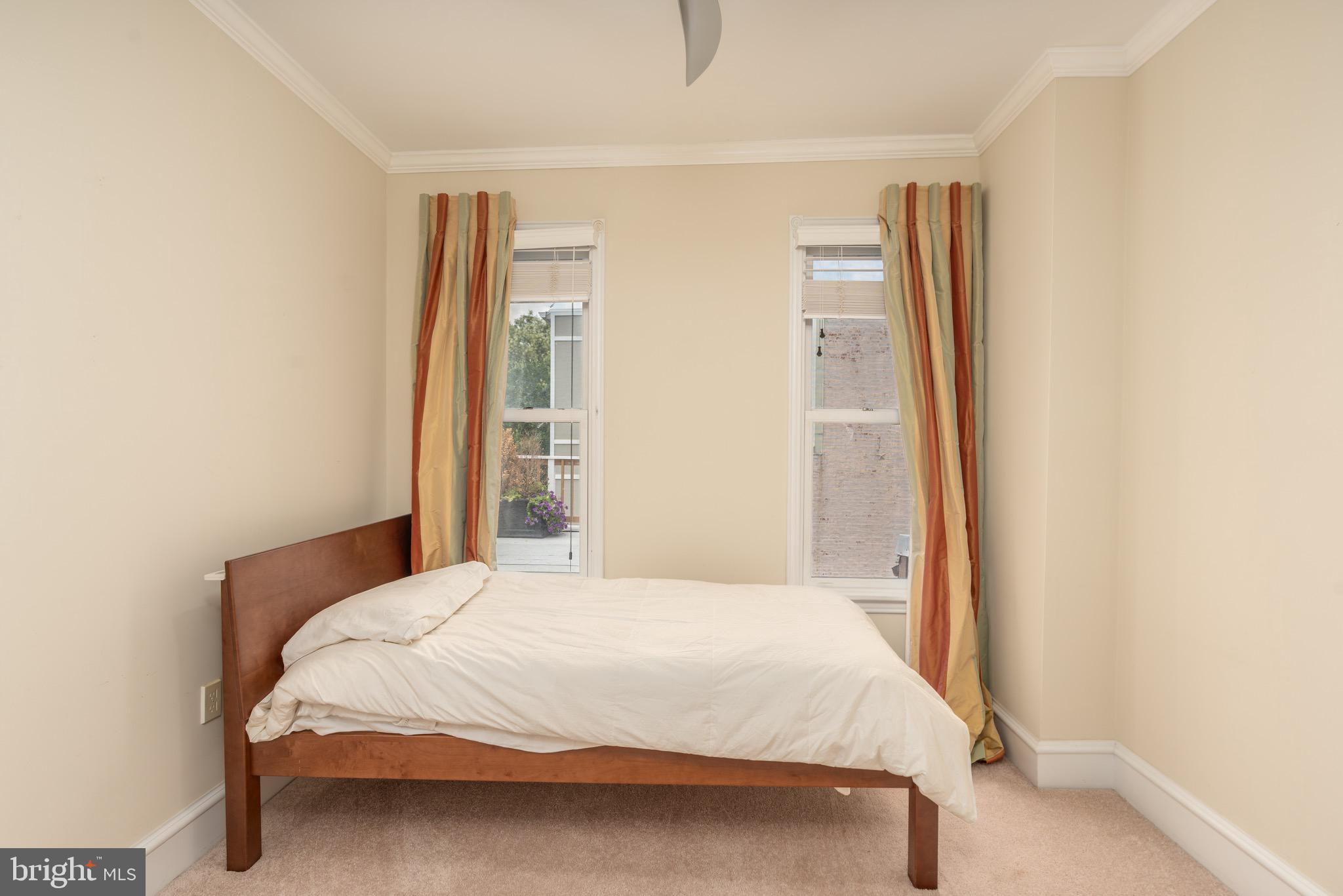 1716 22nd Street Northwest Washington, DC 20008 - Photo 27 of 40 a bedroom with a bed and a window