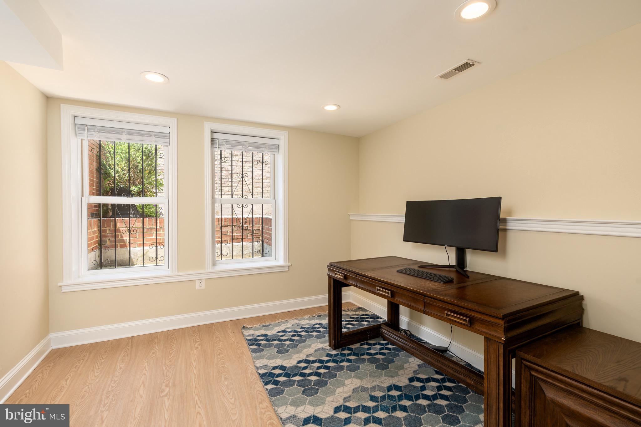 1716 22nd Street Northwest Washington, DC 20008 - Photo 36 of 40 a view of a workspace with furniture and a window