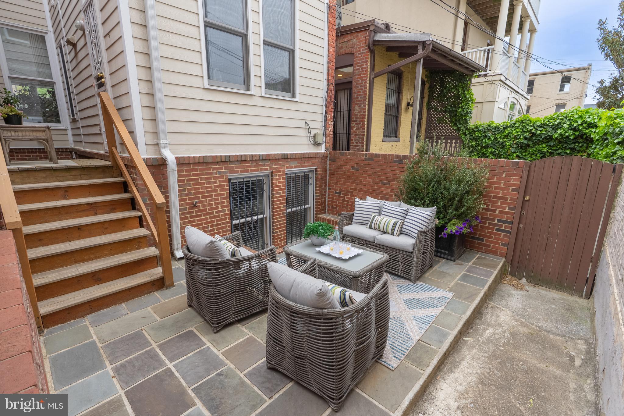 1716 22nd Street Northwest Washington, DC 20008 - Photo 38 of 40 a view of a patio with couches chairs and wooden floor