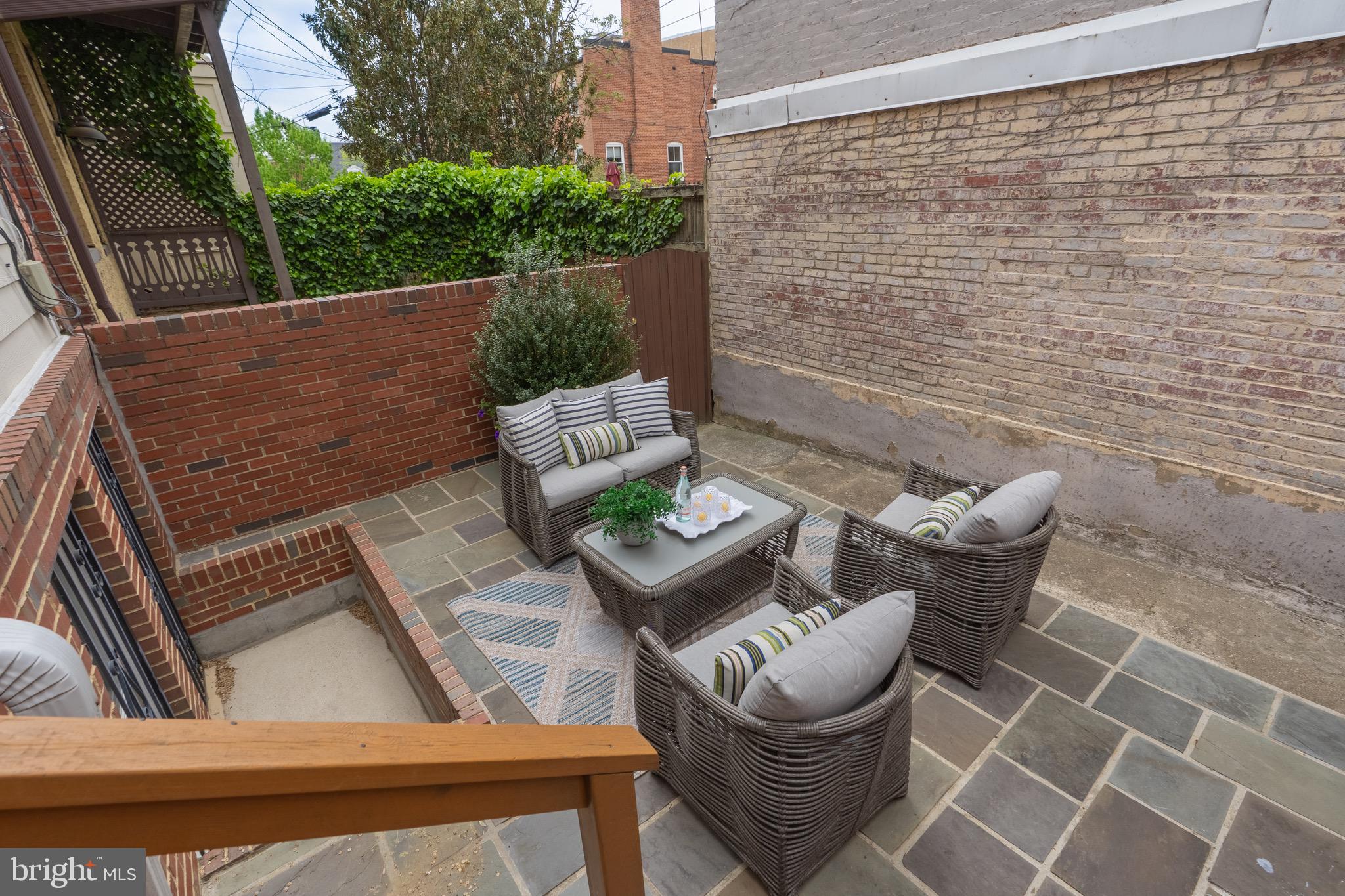 1716 22nd Street Northwest Washington, DC 20008 - Photo 39 of 40 a view of an outdoor sitting area with brick walls