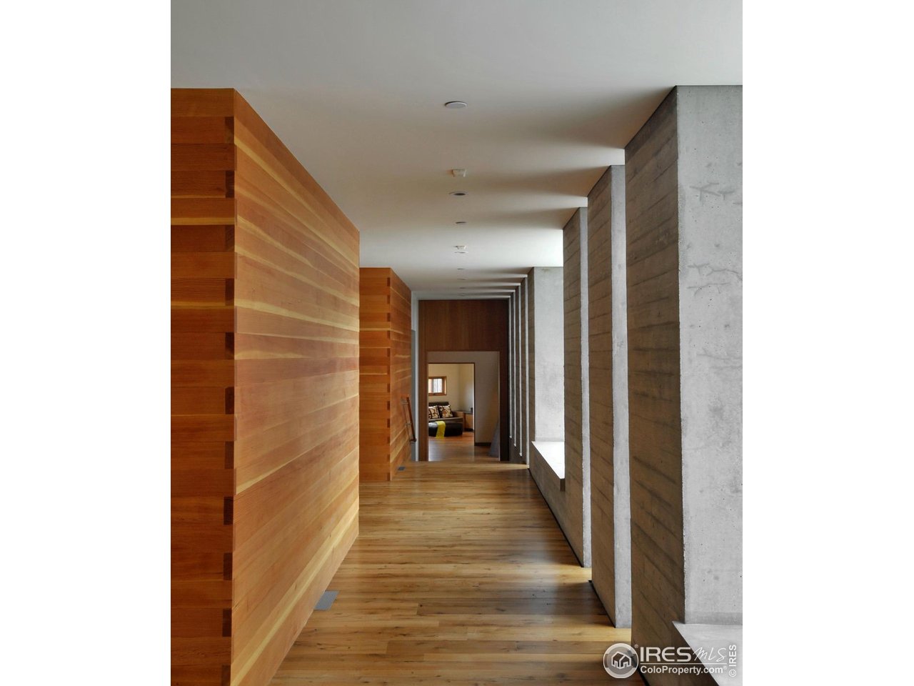 1355 South Cherryvale Road Boulder, CO 80303 - Photo 16 of 40 a view of a hallway with wooden floor and a bathroom