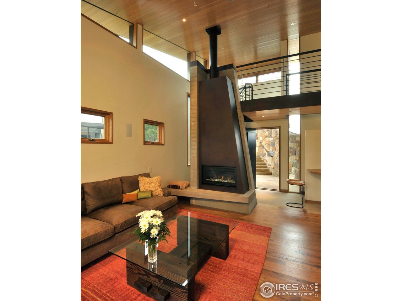 1355 South Cherryvale Road Boulder, CO 80303 - Photo 19 of 40 a living room with furniture and a floor to ceiling window