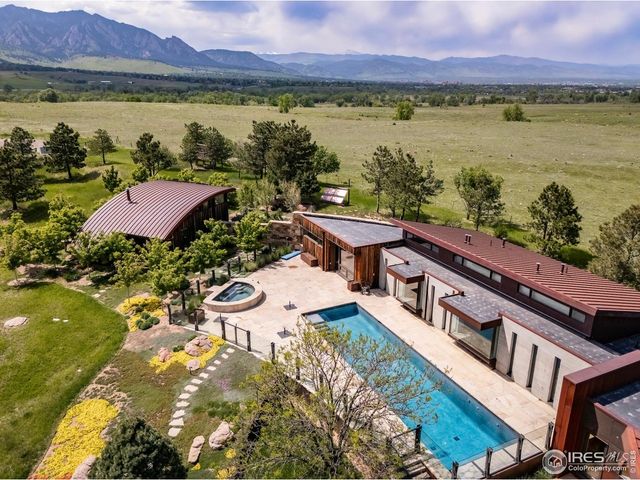 a balcony with an outdoor space and a lake view