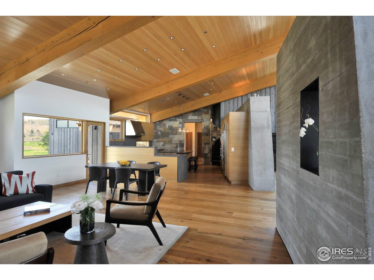 1355 South Cherryvale Road Boulder, CO 80303 - Photo 9 of 40 a dining room with furniture and wooden floor