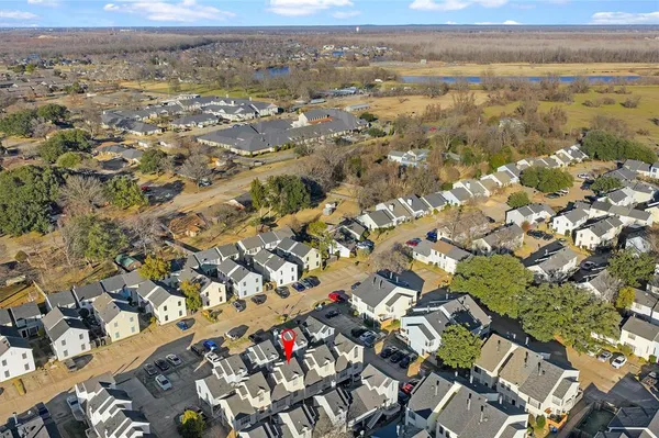 a backyard of a house with barbeque oven table and chairs