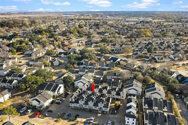 a view of a patio with table and chairs and barbeque