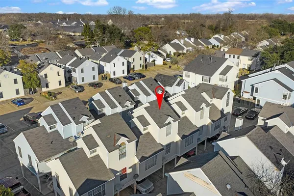 a view of a house with a yard and garage
