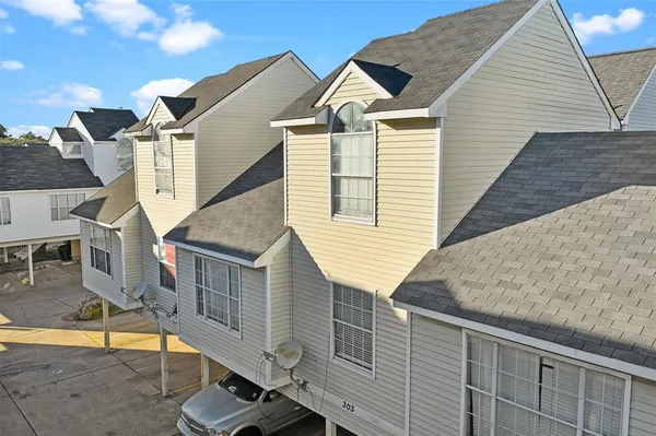 a view of a door with a door and wooden bench