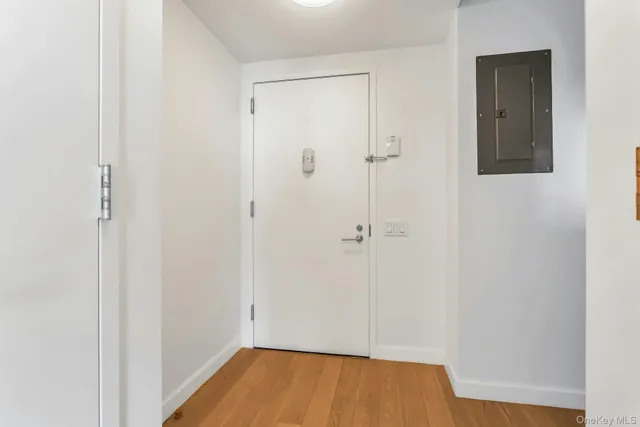 a view of room with wooden floor