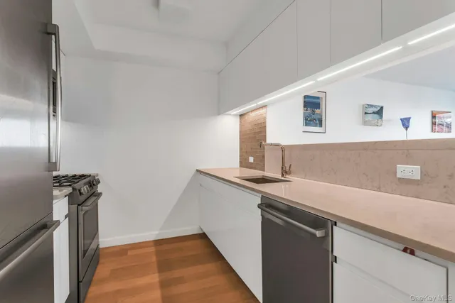 a utility room with sink dryer and washer