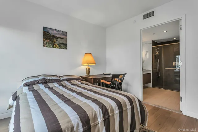 a bedroom with bed and a window