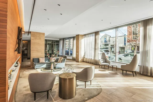 a view of a dining room with furniture water view and a large window
