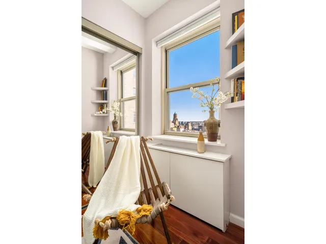 a view of a living room with a sink and cabinets