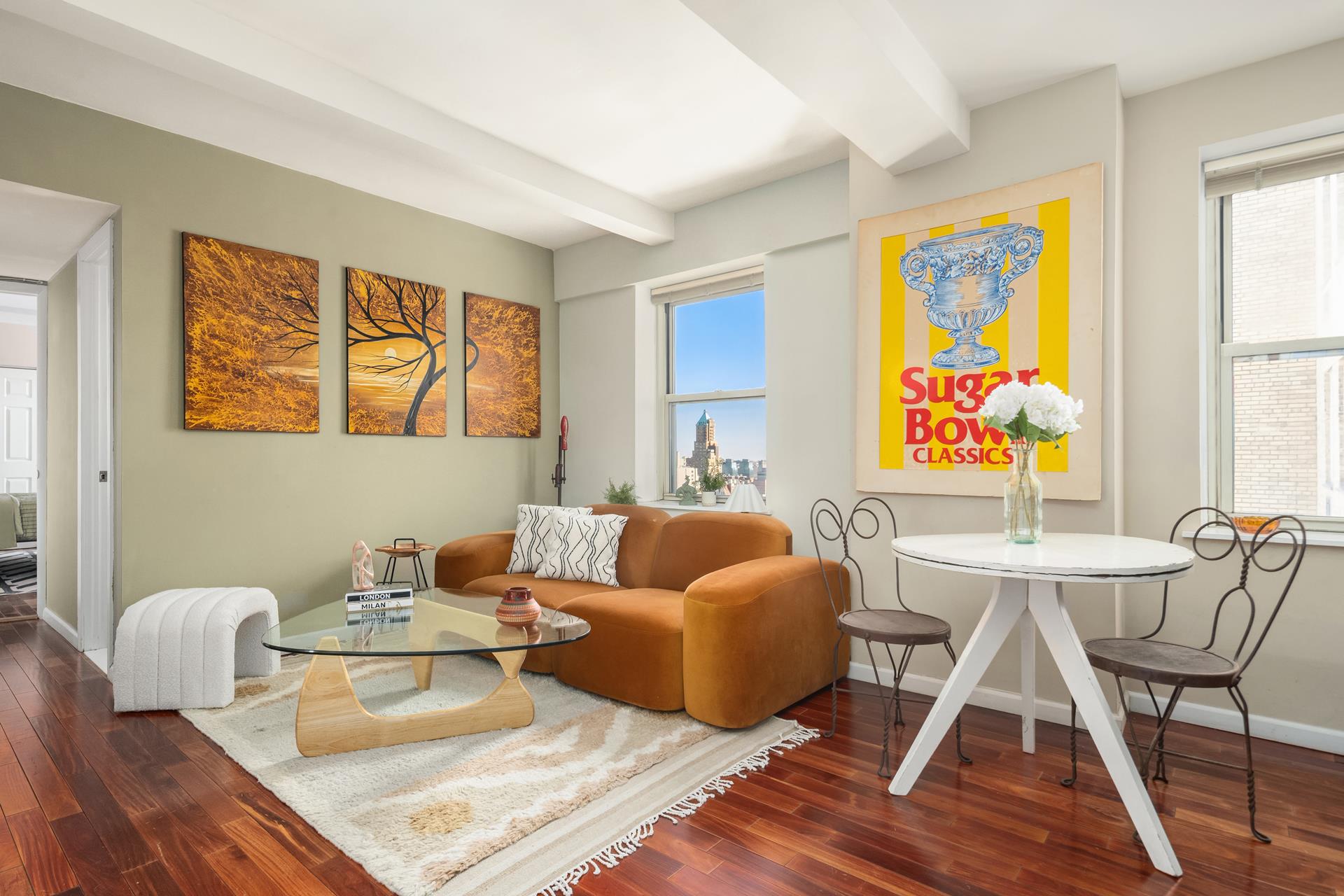 111 Hicks Street, Unit 22G Brooklyn, NY 11201 - Photo 2 of 17 a living room with furniture a flat screen tv and a large window