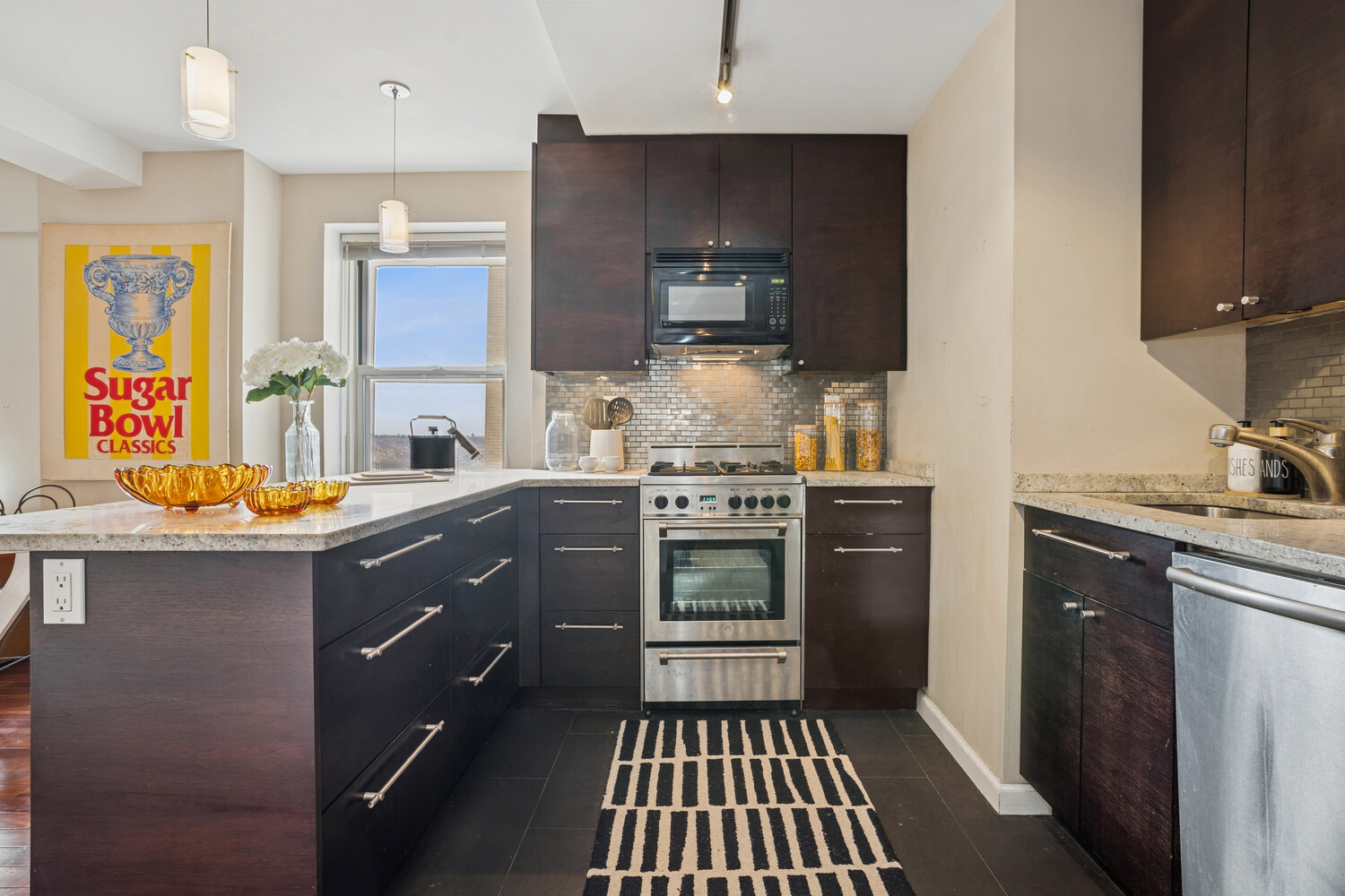 111 Hicks Street, Unit 22G Brooklyn, NY 11201 - Photo 3 of 17 a kitchen with a sink stove and microwave