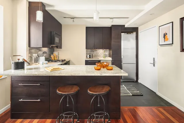 a kitchen with a sink stove and microwave