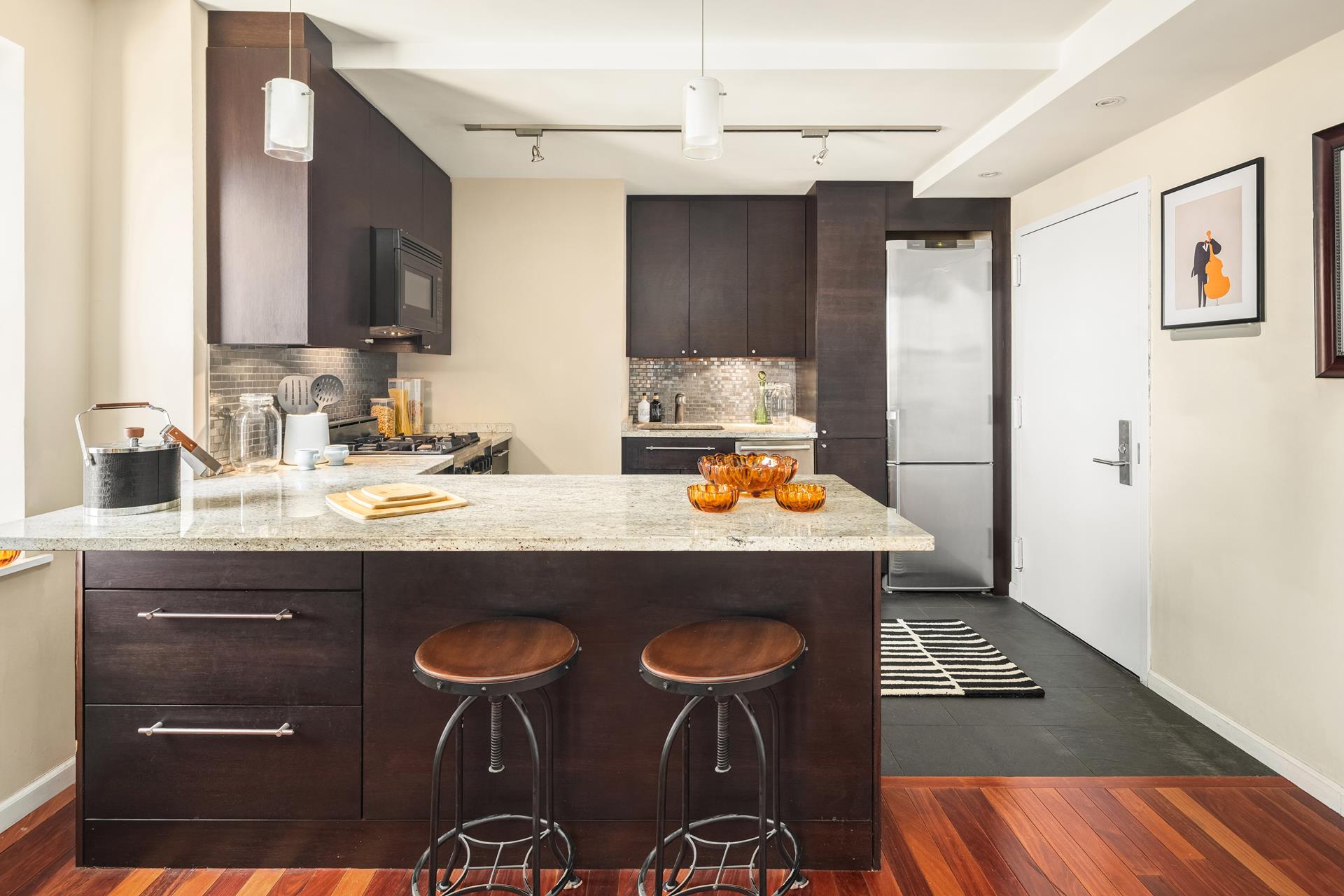 111 Hicks Street, Unit 22G Brooklyn, NY 11201 - Photo 4 of 17 a bathroom with a sink a mirror and a toilet
