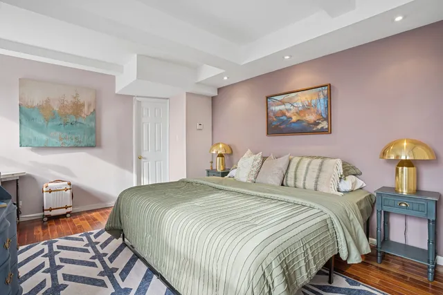 a bedroom with a bed and a desk