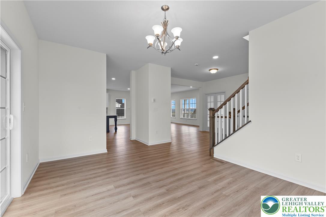 4929 Farrcroft Drive, Unit 83B Easton, PA 18040 - Photo 15 of 30 wooden floor in an empty room with a window