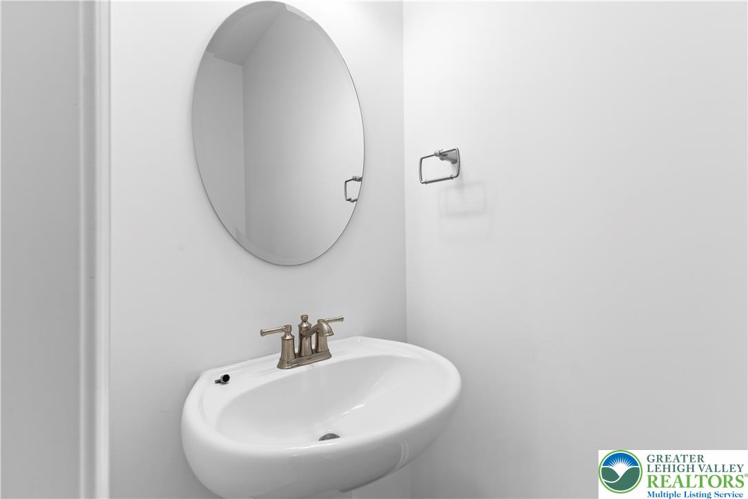 4929 Farrcroft Drive, Unit 83B Easton, PA 18040 - Photo 18 of 30 a bathroom with a sink and a mirror