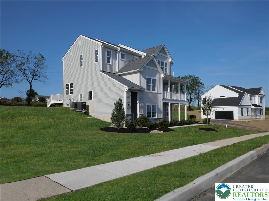 4929 Farrcroft Drive, Unit 83B Easton, PA 18040 - Photo 2 of 30 a front view of a house with a yard