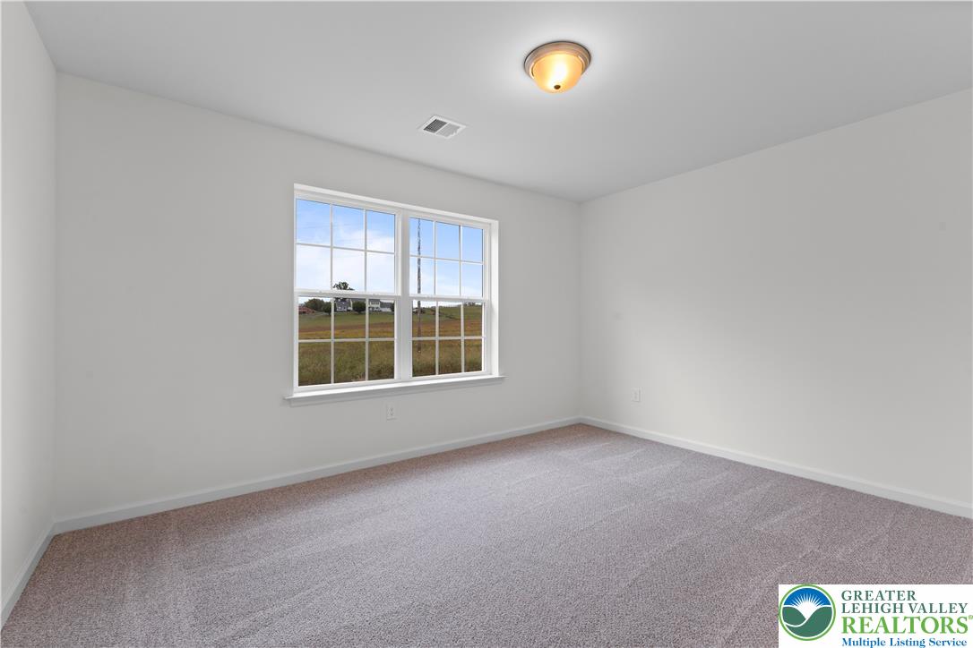 4929 Farrcroft Drive, Unit 83B Easton, PA 18040 - Photo 21 of 30 an empty room with windows