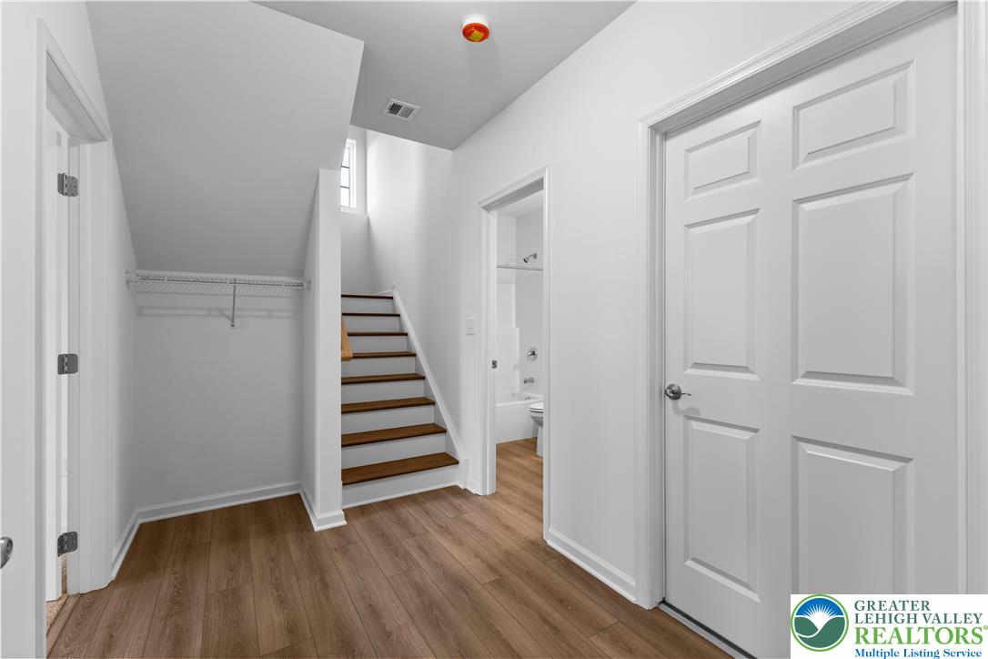 4929 Farrcroft Drive, Unit 83B Easton, PA 18040 - Photo 25 of 30 a view of a hallway with wooden floor and entryway