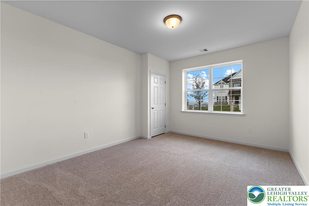 4929 Farrcroft Drive, Unit 83B Easton, PA 18040 - Photo 26 of 30 an empty room with windows