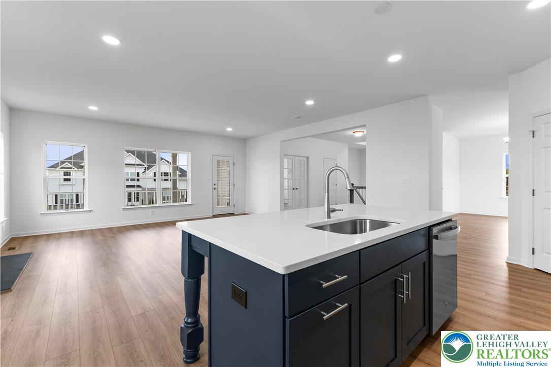 4929 Farrcroft Drive, Unit 83B Easton, PA 18040 - Photo 7 of 30 a kitchen with a sink cabinets and wooden floor