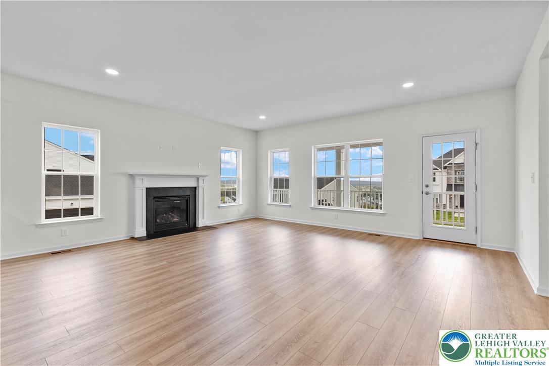 4929 Farrcroft Drive, Unit 83B Easton, PA 18040 - Photo 10 of 30 a view of an empty room with wooden floor and a window