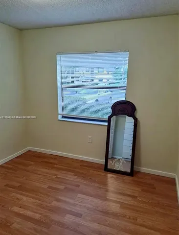 a view of wooden floor in hallway