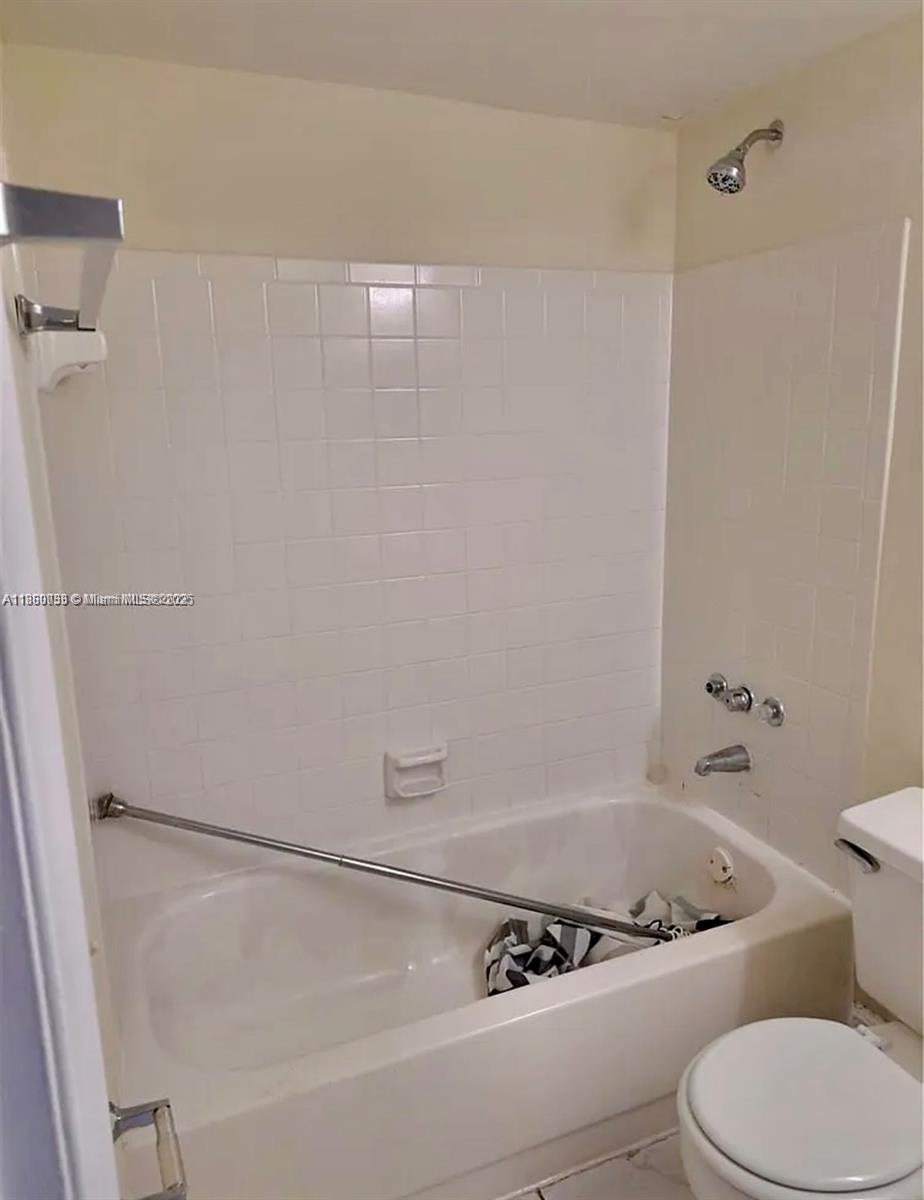 9317 Northwest 1st Court, Unit 105 Pembroke Pines, FL 33024 - Photo 17 of 25 a bathroom with a bathtub and shower