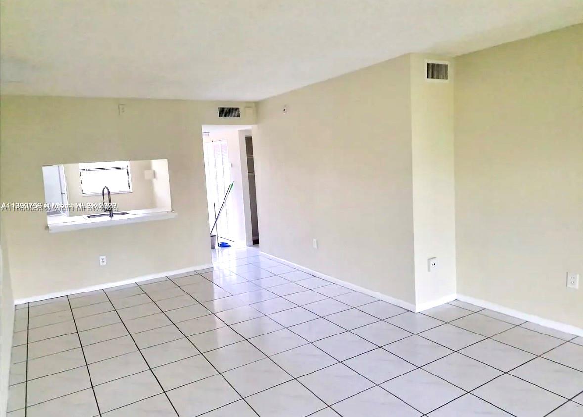 9317 Northwest 1st Court, Unit 105 Pembroke Pines, FL 33024 - Photo 22 of 25 a view of an empty room