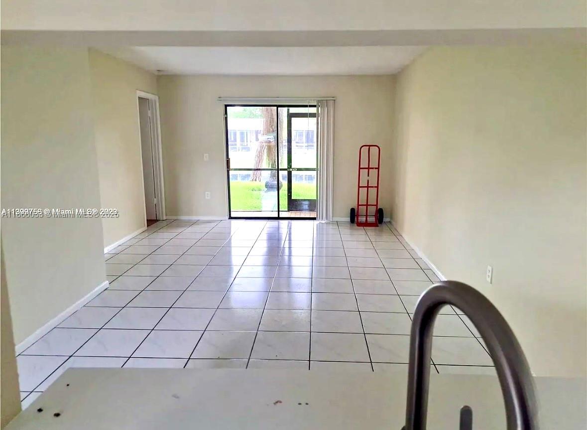 9317 Northwest 1st Court, Unit 105 Pembroke Pines, FL 33024 - Photo 25 of 25 a view of an empty room and window