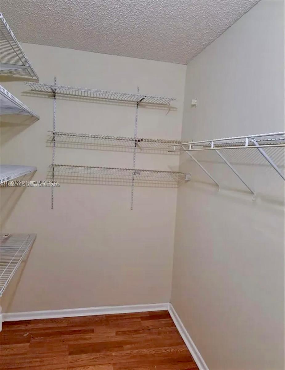9317 Northwest 1st Court, Unit 105 Pembroke Pines, FL 33024 - Photo 10 of 25 a view of a room with racks on the wall