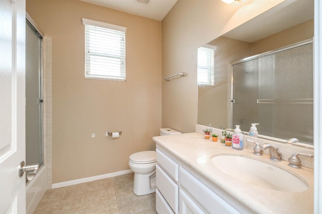 39405 Mountain View Road Yermo, CA 92398 - Photo 16 of 33 a bathroom with a granite countertop sink toilet and shower