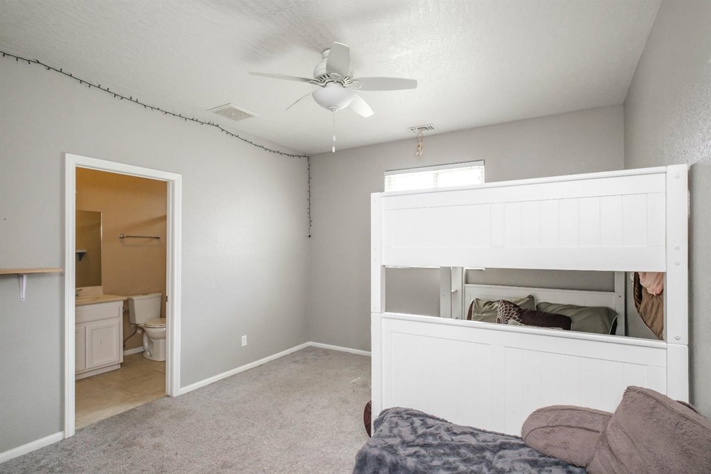39405 Mountain View Road Yermo, CA 92398 - Photo 18 of 33 a bedroom with a bed and a view of bathroom