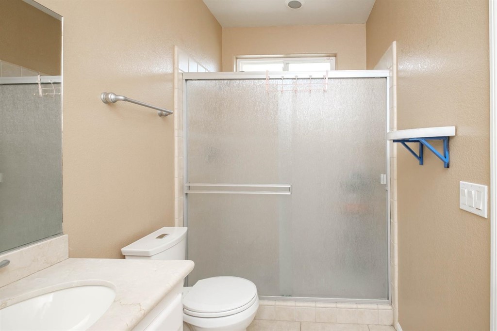 39405 Mountain View Road Yermo, CA 92398 - Photo 19 of 33 a white toilet sitting next to a bathroom sink