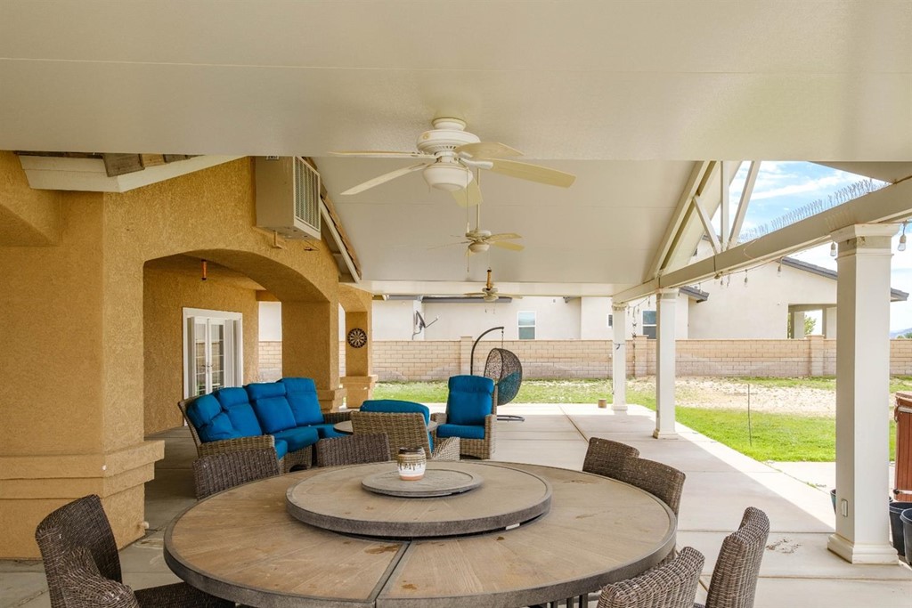 39405 Mountain View Road Yermo, CA 92398 - Photo 28 of 33 a dining room with furniture a large window and a fireplace
