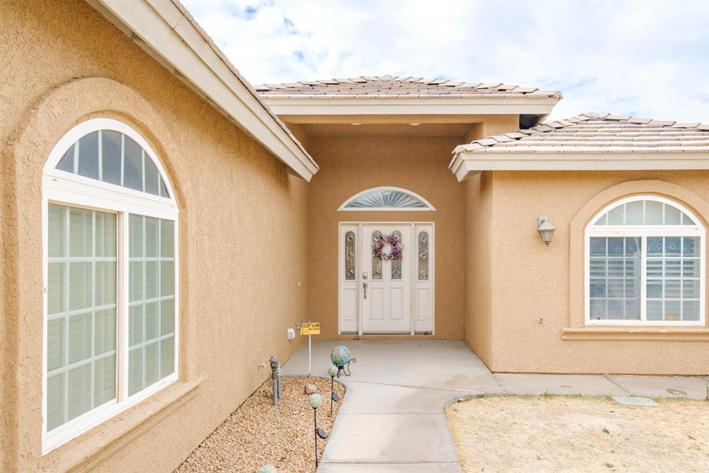 39405 Mountain View Road Yermo, CA 92398 - Photo 4 of 33 a front view of a house with large windows
