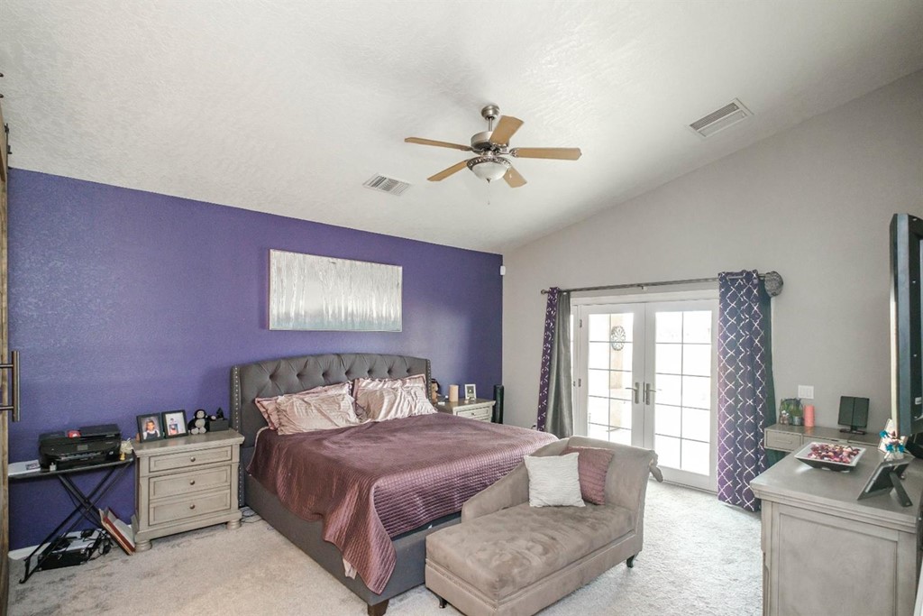 39405 Mountain View Road Yermo, CA 92398 - Photo 7 of 33 a bedroom with a bed and wooden floor
