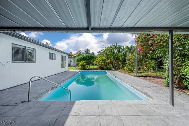 a front view of house with yard and outdoor seating