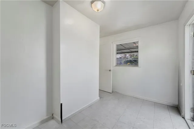 a view of a hallway with a refrigerator