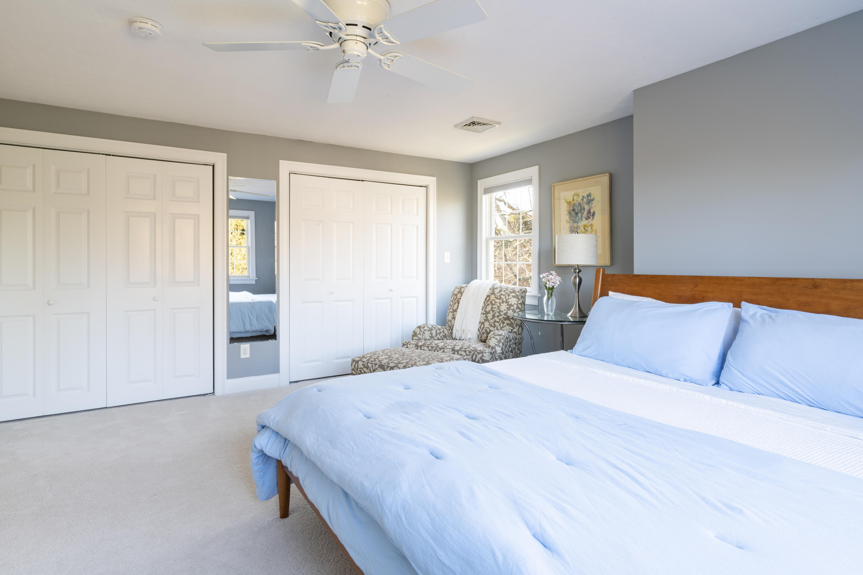 2 Parallel Street Harwich, MA 02645 - Photo 24 of 40 a bedroom with a large bed and a chandelier