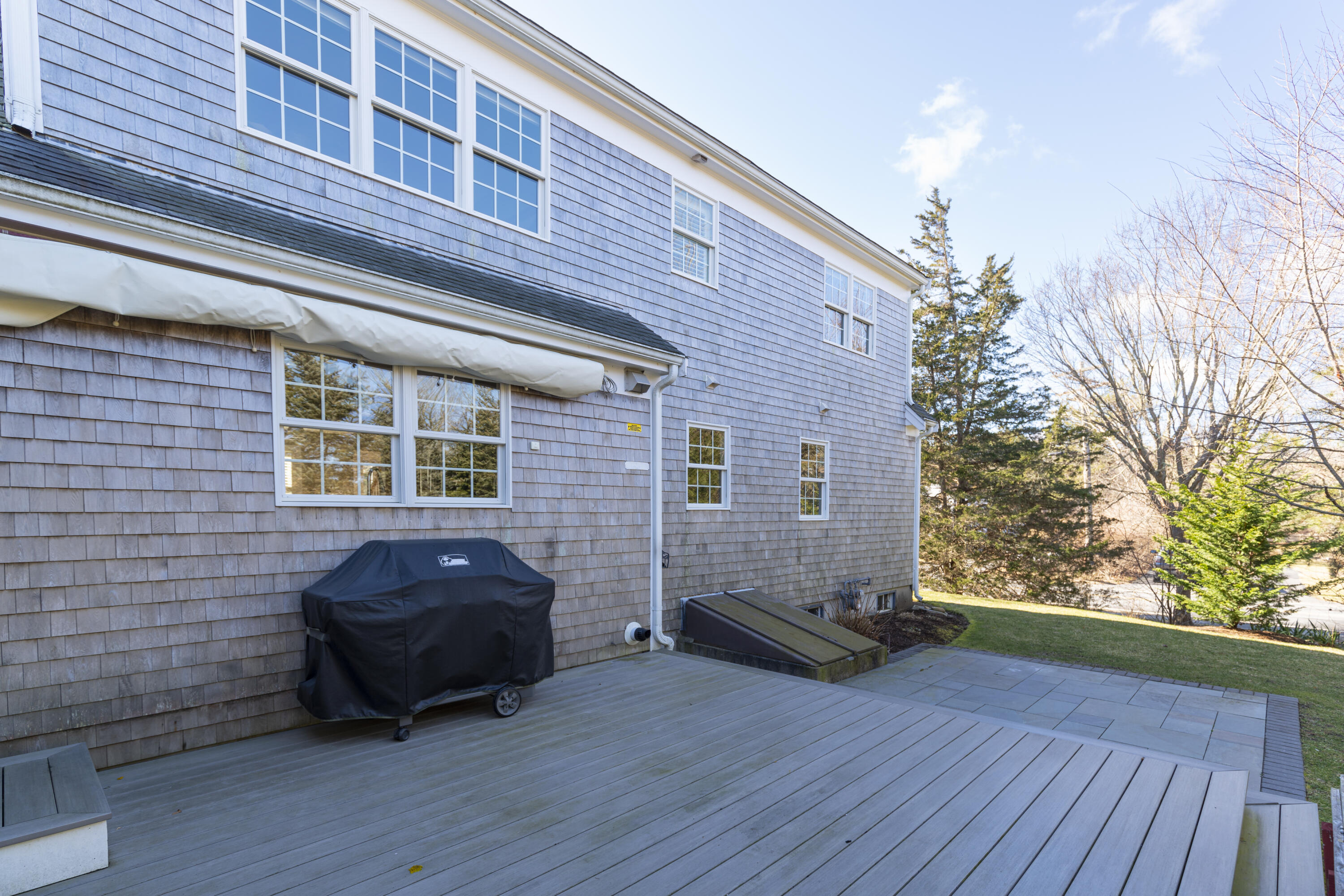 2 Parallel Street Harwich, MA 02645 - Photo 34 of 40 a car parked in front of a brick house
